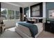 Cozy main bedroom featuring ample natural light and designer touches at 2726 Wise River Lane, Zephyrhills, FL 33539