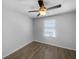 Bedroom featuring wood floors and a ceiling fan at 1311 Trailwater St, Ruskin, FL 33570