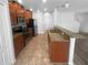 Well-equipped kitchen with stainless appliances and a breakfast bar overlooking the living area at 1311 Trailwater St, Ruskin, FL 33570