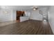 Spacious living area with hardwood floors seamlessly connects the kitchen and dining spaces at 1311 Trailwater St, Ruskin, FL 33570