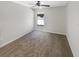 Clean, neutral bedroom with a large window and plush carpet at 30406 Arrochar St, Wesley Chapel, FL 33545