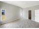 Neutral bedroom with carpet floors, natural light and walk-in closet at 30406 Arrochar St, Wesley Chapel, FL 33545