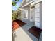 Well-maintained front yard with manicured landscaping and a charming facade, plus a walkway leading to the front door at 30406 Arrochar St, Wesley Chapel, FL 33545
