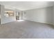 Bright living room with neutral decor, a view into the kitchen, and ample natural light at 30406 Arrochar St, Wesley Chapel, FL 33545