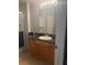 Bathroom featuring tile floors, dark vanity countertop, a large mirror and a shower at 5125 Palm Springs Blvd # 13107, Tampa, FL 33647