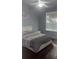 Cozy bedroom featuring neutral colors, a ceiling fan, and comfortable bedding at 5125 Palm Springs Blvd # 13107, Tampa, FL 33647