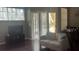 Cozy living room featuring hardwood floors, neutral paint, sliding glass doors and a view of the lanai at 5125 Palm Springs Blvd # 13107, Tampa, FL 33647