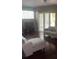 Open living room with hardwood floors, neutral paint, sofa and a view of the lanai at 5125 Palm Springs Blvd # 13107, Tampa, FL 33647