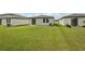 Spacious backyard featuring lush green grass perfect for outdoor activities at 14106 Crutchfield Ct, Parrish, FL 34219