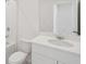 The bathroom features bright lighting, white cabinets, and ample counter space at 14106 Crutchfield Ct, Parrish, FL 34219