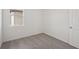 This bedroom features neutral carpet and a window that lets in natural light at 14106 Crutchfield Ct, Parrish, FL 34219