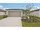 Beautiful single-story home featuring a wide driveway and a two-car garage at 14106 Crutchfield Ct, Parrish, FL 34219