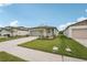 Charming single-story home featuring a well-manicured lawn and neutral color palette at 14106 Crutchfield Ct, Parrish, FL 34219