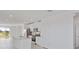 Bright, open kitchen features white cabinets, stainless steel appliances, and an eat-in kitchen island at 149 Whiteland Bnd, Nokomis, FL 34275