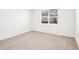 Cozy bedroom with soft carpet, a window for natural light, and neutral paint at 1752 Brekey Way, Zephyrhills, FL 33541