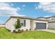 A view of the exterior of the home, highlighting its architectural style and curb appeal at 1752 Brekey Way, Zephyrhills, FL 33541