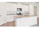 Modern kitchen featuring granite countertops, stainless steel appliances, and ample cabinet space at 1752 Brekey Way, Zephyrhills, FL 33541