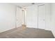 The bedroom has carpeted floors, a closet with sliding doors, and white trim and doors at 1787 Draughton Dr, Zephyrhills, FL 33541