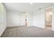 Spacious bedroom with plush carpet, and ample natural light at 1787 Draughton Dr, Zephyrhills, FL 33541