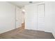 Bedroom with a closet with sliding doors and neutral carpet flooring at 1787 Draughton Dr, Zephyrhills, FL 33541