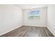 Dining room with wood-look flooring, a chandelier, and a window offering natural light at 1787 Draughton Dr, Zephyrhills, FL 33541