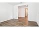 Open living space featuring wood-look tile flooring, bright lighting, and neutral paint at 1787 Draughton Dr, Zephyrhills, FL 33541