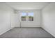 Bright, carpeted bedroom with large windows and ample closet space at 1839 Brekey Way, Zephyrhills, FL 33541