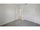 Bedroom featuring a closet with bi-fold doors and a door to an en-suite bathroom at 1839 Brekey Way, Zephyrhills, FL 33541