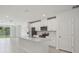 Modern kitchen with stainless steel appliances, quartz countertops and an island with a sink at 1839 Brekey Way, Zephyrhills, FL 33541