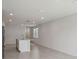 Modern kitchen island with a sink, open concept views and hard surface flooring at 1839 Brekey Way, Zephyrhills, FL 33541