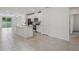 Spacious open-concept kitchen and living area featuring sleek appliances and ample counter space at 1839 Brekey Way, Zephyrhills, FL 33541