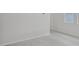 Neutral colored room with baseboards, hard surface floors, light walls, and natural lighting at 1839 Brekey Way, Zephyrhills, FL 33541