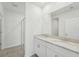 Bathroom showcasing a double sink vanity, granite countertops, and a glass-enclosed shower at 1861 Brekey Way, Zephyrhills, FL 33541