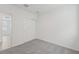 Bedroom with neutral carpeting, bright window, and closet at 1861 Brekey Way, Zephyrhills, FL 33541