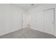 Bedroom with neutral carpeting, bright window, and closet at 1861 Brekey Way, Zephyrhills, FL 33541