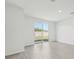Living space features light modern flooring and large sliding glass doors at 1861 Brekey Way, Zephyrhills, FL 33541