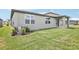 Spacious backyard offering a well-maintained lawn and fresh landscaping at 1870 Draughton Dr, Zephyrhills, FL 33541