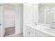 Bright bathroom with double vanity, walk-in closet and glass shower at 1870 Draughton Dr, Zephyrhills, FL 33541