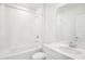 Clean bathroom with a tub, shower, white vanity, and a large mirror above the sink at 1870 Draughton Dr, Zephyrhills, FL 33541