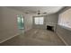 Bright living room with a ceiling fan, a fireplace, neutral paint, and large windows at 280 46Th Ave, St Pete Beach, FL 33706