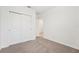 Bedroom with a view to the hallway and a double door closet at 31643 Wild Grape Ln, Brooksville, FL 34602