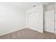 Clean bedroom with sliding door closet and neutral color scheme at 31643 Wild Grape Ln, Brooksville, FL 34602