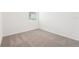 Comfortable bedroom with wall-to-wall carpeting and window at 31643 Wild Grape Ln, Brooksville, FL 34602