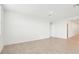 Bright and airy living room with neutral tile flooring and recessed lighting at 31643 Wild Grape Ln, Brooksville, FL 34602