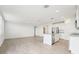 Open-concept kitchen and living room area with stainless steel appliances at 31643 Wild Grape Ln, Brooksville, FL 34602