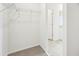 Walk-in closet with metal racks and carpet at 31643 Wild Grape Ln, Brooksville, FL 34602
