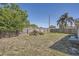 Spacious backyard with a well-maintained wood fence surrounding the perimeter at 3206 Peterborough St, Holiday, FL 34690