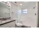 This bathroom has granite countertops, a white vanity, and a tiled walk-in shower at 3206 Peterborough St, Holiday, FL 34690