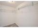 A walk-in closet provides ample storage space with wire shelving at 3206 Peterborough St, Holiday, FL 34690
