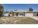 Charming single-story home featuring a covered entrance and brick walkway to the front door at 3206 Peterborough St, Holiday, FL 34690